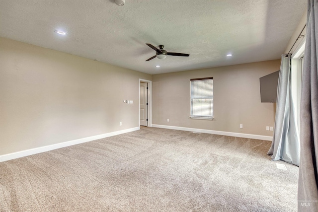 unfurnished room featuring baseboards, a ceiling fan, carpet flooring, and recessed lighting