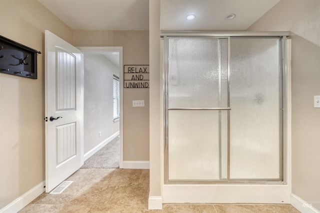 bathroom with baseboards, an enclosed shower, visible vents, and recessed lighting