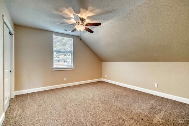 bonus room featuring visible vents, a ceiling fan, baseboards, and carpet flooring