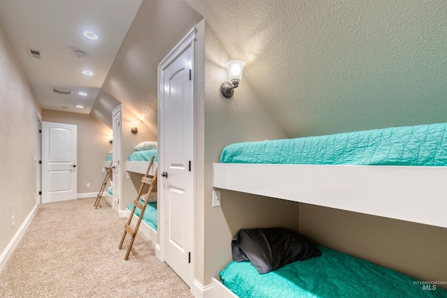 bedroom featuring light colored carpet, baseboards, and visible vents