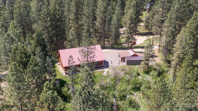 aerial view featuring a wooded view