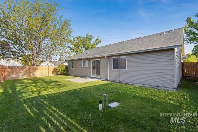 rear view of house with a patio