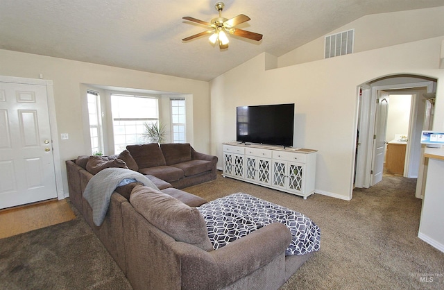 carpeted living room featuring ceiling fan and lofted ceiling