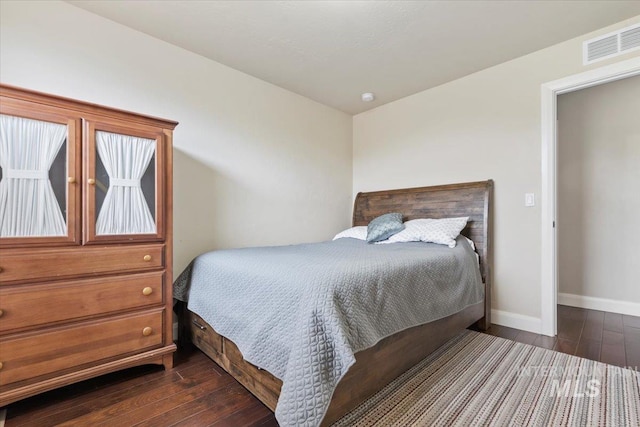 4680 N Maplestone Ave, Meridian, ID 83646 - bedroom with dark wood-style flooring and baseboards