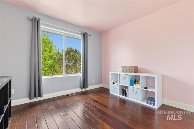 4680 N Maplestone Ave, Meridian, ID 83646 - empty room featuring dark wood-type flooring and baseboards