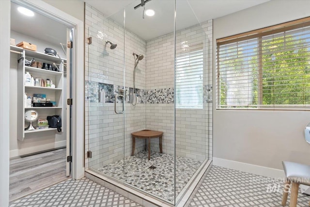 4680 N Maplestone Ave, Meridian, ID 83646 - full bathroom featuring a shower stall, plenty of natural light, and baseboards