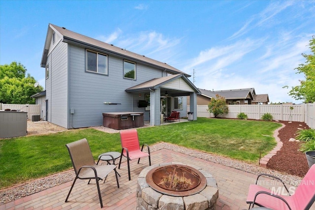 4680 N Maplestone Ave, Meridian, ID 83646 - back of house with a hot tub, a fire pit, a patio area, and central air condition unit