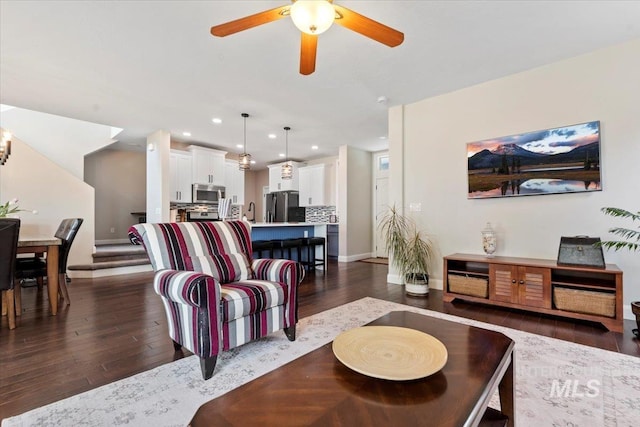4680 N Maplestone Ave, Meridian, ID 83646 - living room featuring dark wood-type flooring, ceiling fan, baseboards, and recessed lighting