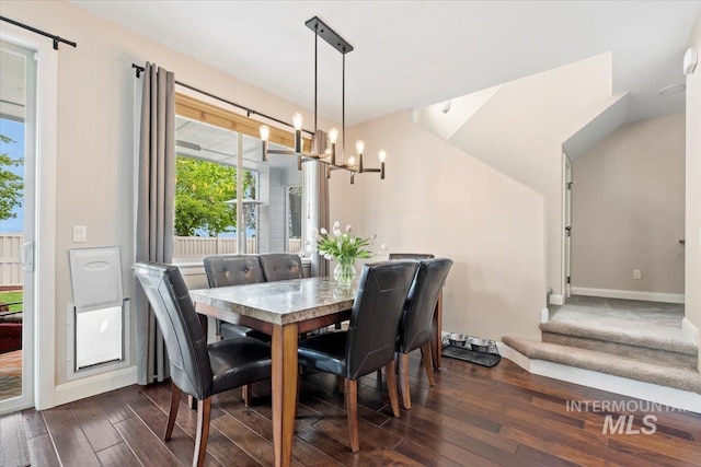 4680 N Maplestone Ave, Meridian, ID 83646 - dining area with a chandelier, dark wood-type flooring, healthy amount of natural light, and baseboards