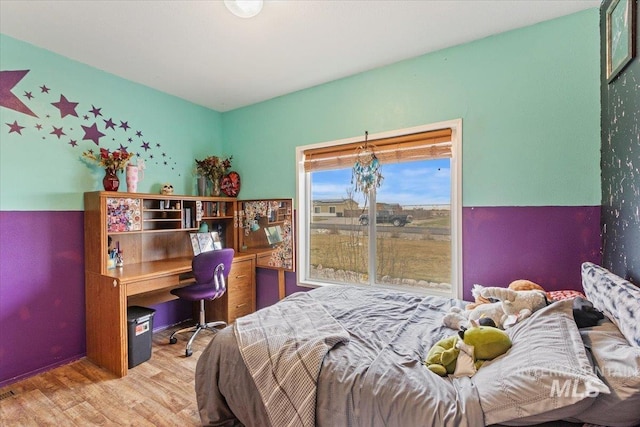 3834 N 2381 E, Filer, ID 83328 - bedroom with wood finished floors and a desk