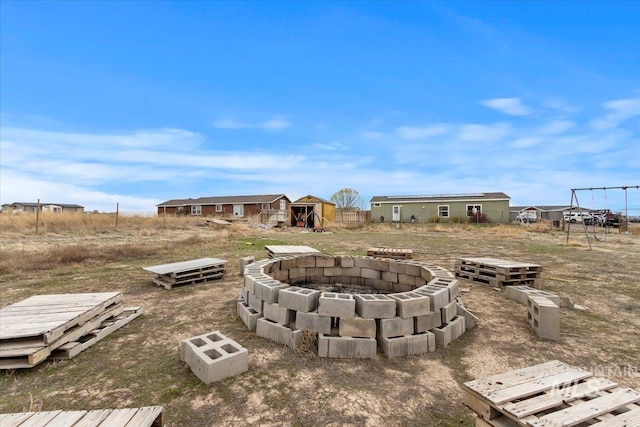 3834 N 2381 E, Filer, ID 83328 - view of yard featuring a fire pit, an outbuilding, fence, and a storage shed