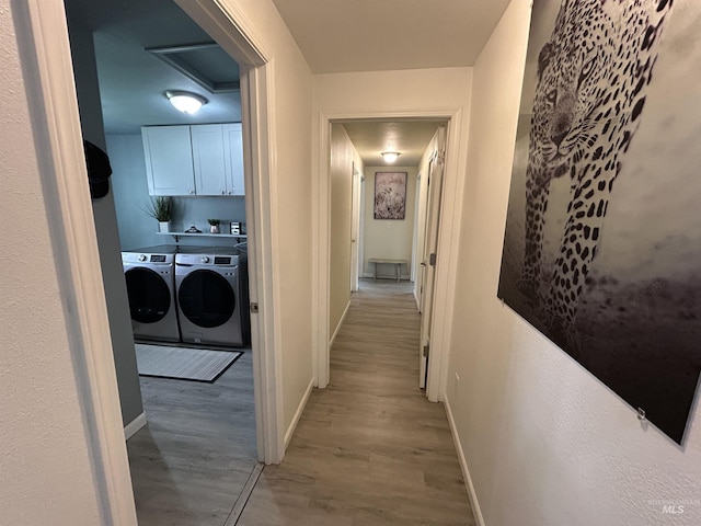 139 119th St, Orofino, ID 83544 - corridor with independent washer and dryer, light wood finished floors, attic access, and baseboards