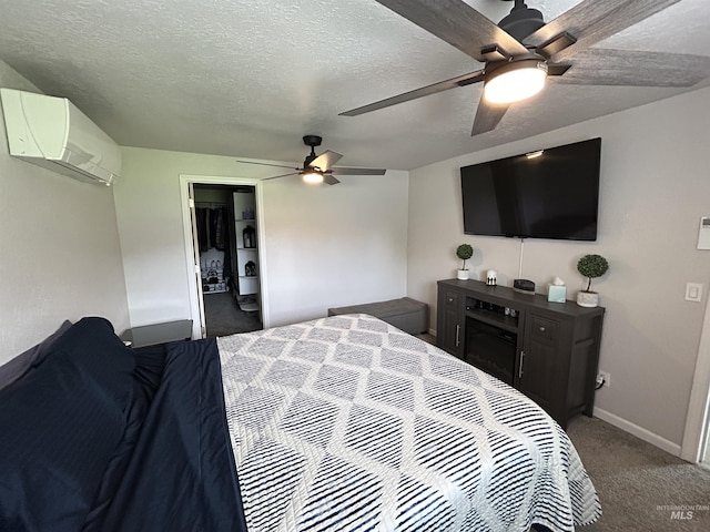 139 119th St, Orofino, ID 83544 - bedroom with carpet flooring, baseboards, a wall mounted AC, and a textured ceiling
