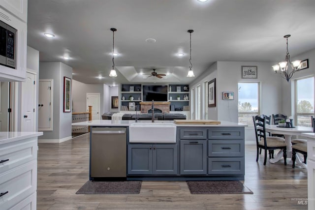 3330 E 4050 N, Twin Falls, ID 83301 - kitchen featuring baseboards, gray cabinets, light countertops, appliances with stainless steel finishes, and ceiling fan with notable chandelier