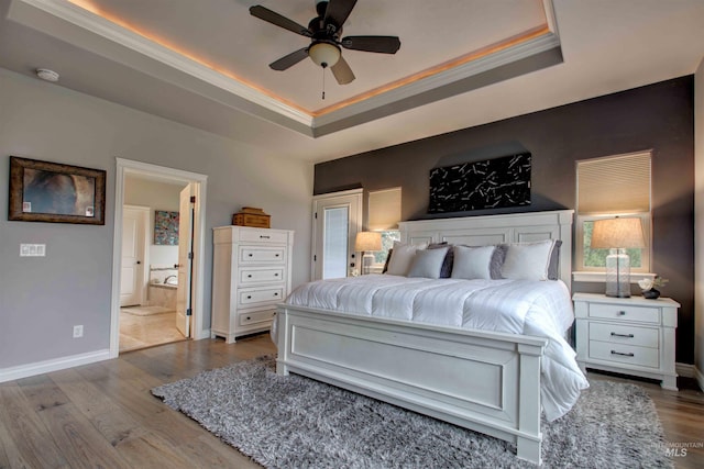 3330 E 4050 N, Twin Falls, ID 83301 - bedroom with a tray ceiling, wood finished floors, baseboards, and ensuite bath