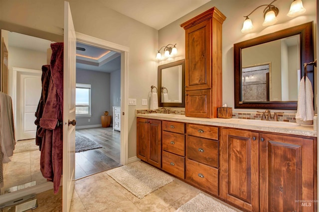 3330 E 4050 N, Twin Falls, ID 83301 - bathroom featuring double vanity, a sink, tile patterned flooring, and baseboards