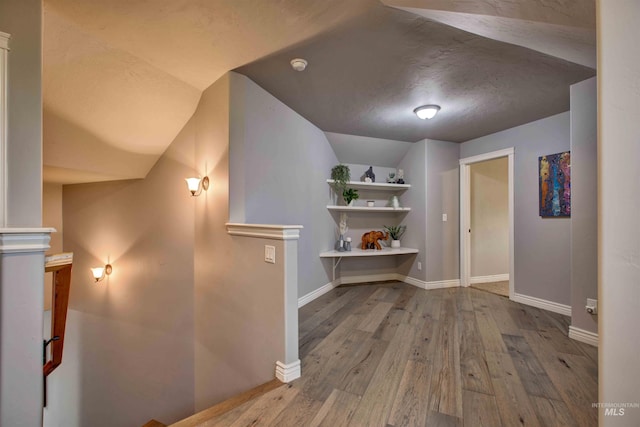 3330 E 4050 N, Twin Falls, ID 83301 - corridor featuring baseboards, wood finished floors, and vaulted ceiling