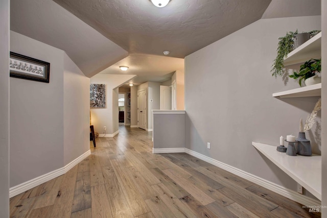3330 E 4050 N, Twin Falls, ID 83301 - hallway featuring baseboards, lofted ceiling, and hardwood / wood-style flooring