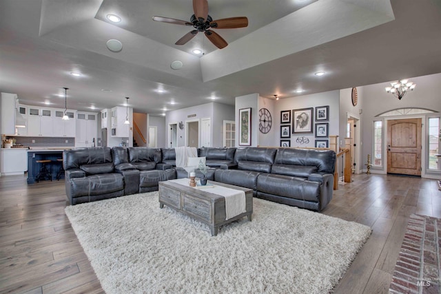 3330 E 4050 N, Twin Falls, ID 83301 - living room with ceiling fan with notable chandelier, recessed lighting, stairway, hardwood / wood-style floors, and a raised ceiling