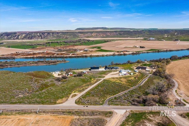 aerial view featuring a rural view and a water view