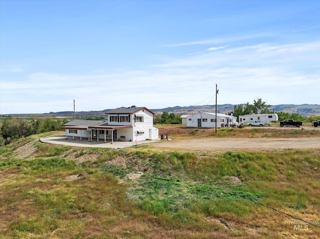 8662 State Highway 78, Marsing, ID 83639 - view of yard featuring a patio area, a mountain view, and dirt driveway