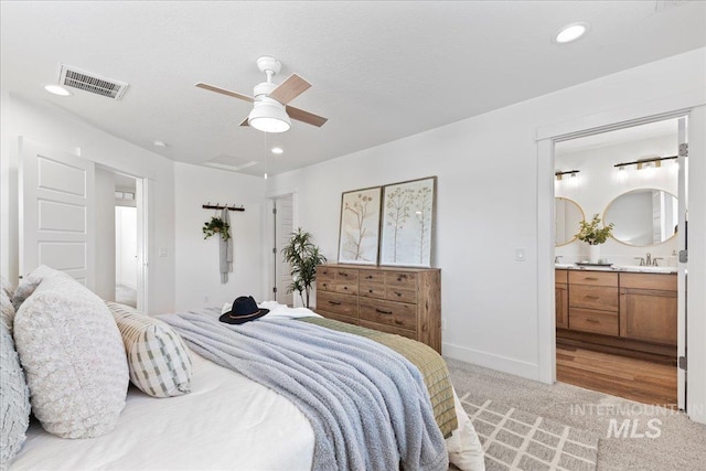 1447 N Pineview Ln, Boise, ID 83713 - bedroom with light carpet, ensuite bath, ceiling fan, and recessed lighting