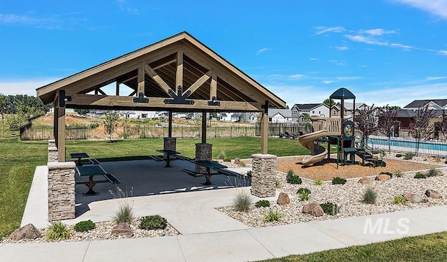 surrounding community featuring a gazebo, a lawn, playground community, and fence