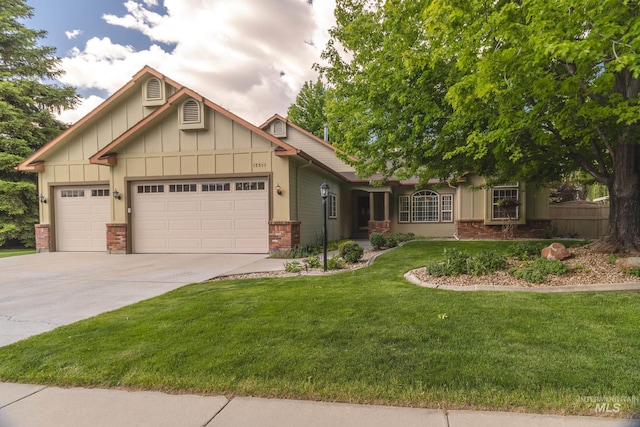 view of front of house featuring brick siding, concrete driveway, an attached garage, board and batten siding, and a front yard