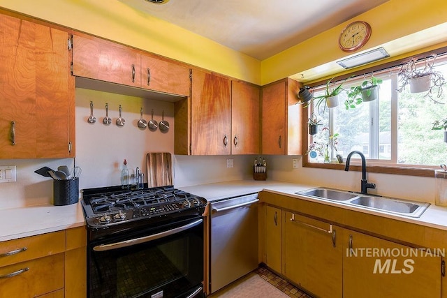 1021 E 5th St, Moscow, ID 83843 - kitchen featuring gas stove, dishwasher, light countertops, and brown cabinets