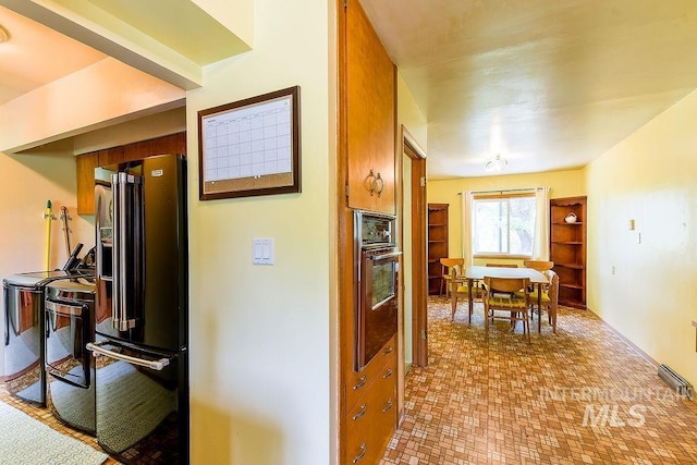 1021 E 5th St, Moscow, ID 83843 - corridor featuring separate washer and dryer