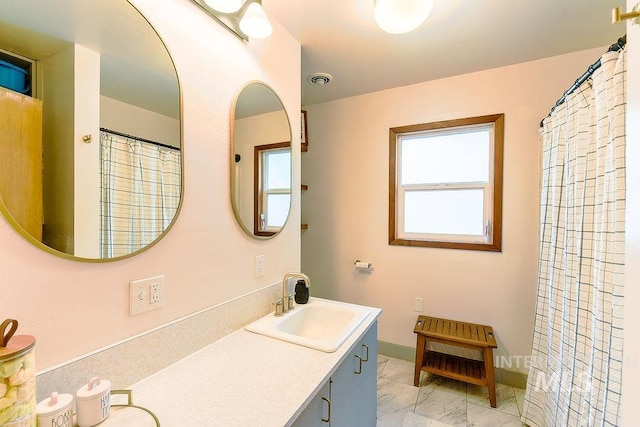 1021 E 5th St, Moscow, ID 83843 - full bathroom with marble finish floors and double vanity