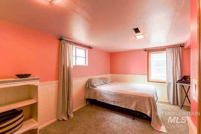 1021 E 5th St, Moscow, ID 83843 - bedroom with a wainscoted wall and carpet