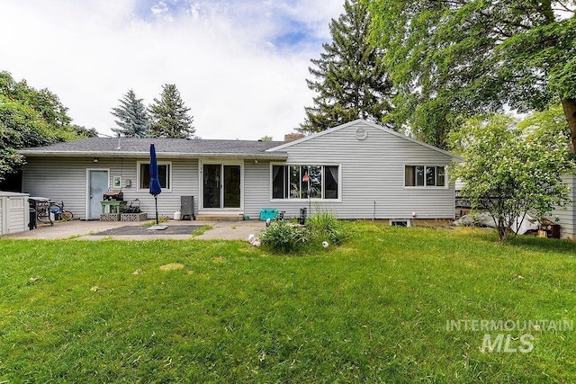 1021 E 5th St, Moscow, ID 83843 - back of house featuring a patio area and a lawn