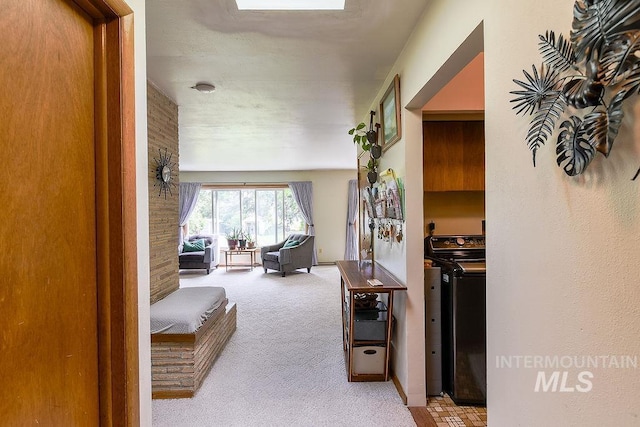 1021 E 5th St, Moscow, ID 83843 - hall with carpet flooring and washer and clothes dryer