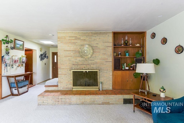 1021 E 5th St, Moscow, ID 83843 - living area featuring carpet, a fireplace, and built in features