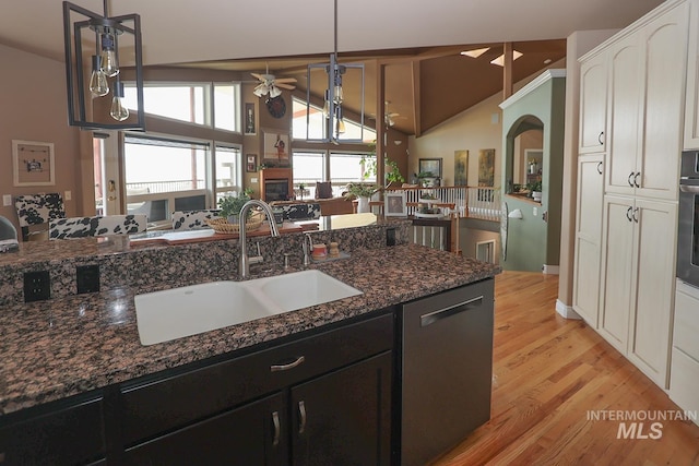 kitchen with dark stone countertops, white cabinetry, decorative light fixtures, ceiling fan, and appliances with stainless steel finishes