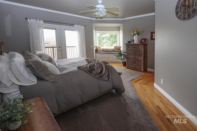 bedroom with ornamental molding, access to outside, ceiling fan, french doors, and hardwood / wood-style flooring