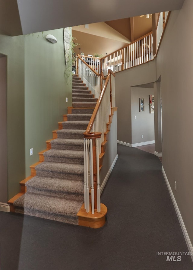 stairway with a towering ceiling