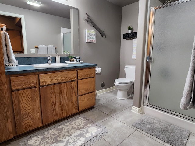 bathroom featuring tile patterned floors, walk in shower, toilet, and vanity