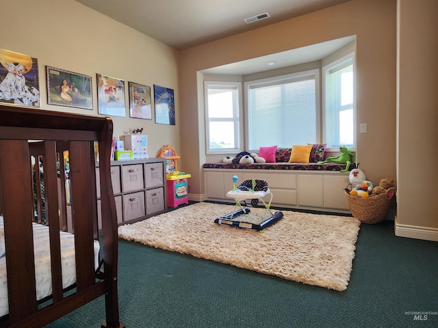 carpeted bedroom with multiple windows