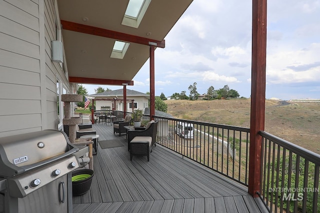 wooden deck with a grill