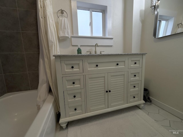 bathroom with vanity and shower / bath combination with curtain