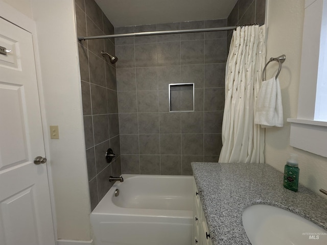 bathroom featuring vanity and shower / tub combo