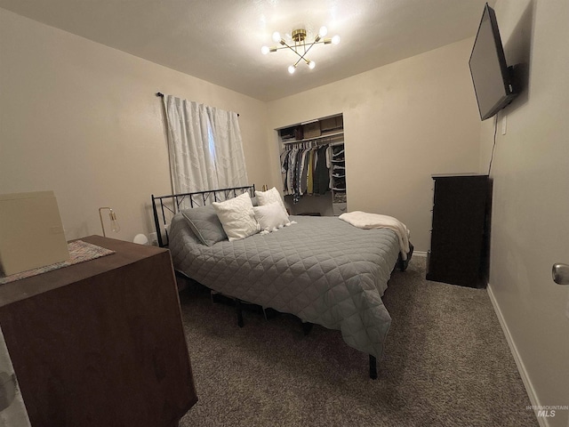 carpeted bedroom featuring a closet and a notable chandelier