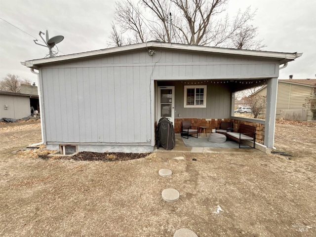 rear view of property with a patio area