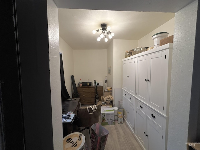 office with light hardwood / wood-style flooring