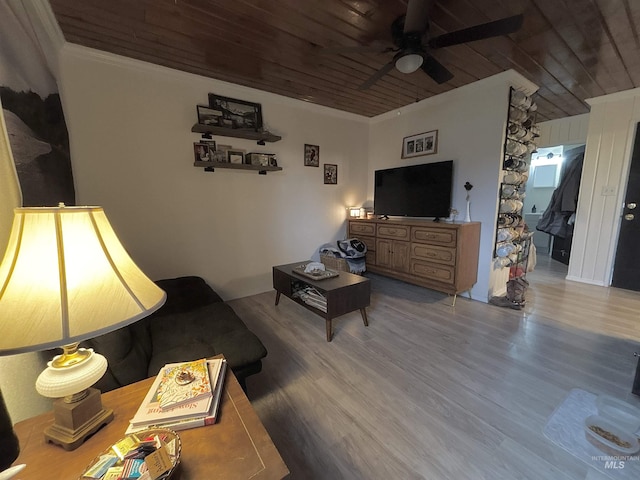 living room with hardwood / wood-style flooring, wooden ceiling, and ceiling fan