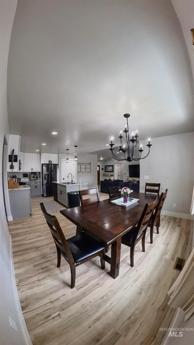 808 Adell Ave, Filer, ID 83328 - dining room featuring light wood-style floors, baseboards, recessed lighting, and a notable chandelier