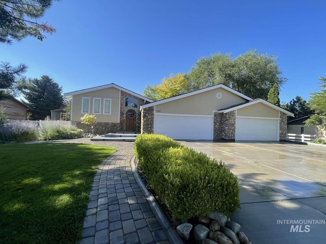 ranch-style house with a front lawn and a garage