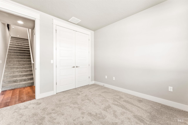 4469 E Wingate Ct, Nampa, ID 83687 - unfurnished bedroom with carpet floors, baseboards, a closet, and lofted ceiling